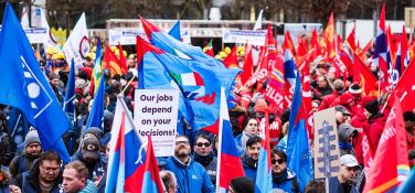 Sign reading "our jobs depend on your decisions" at an industriAll Europe rally in Brussels.